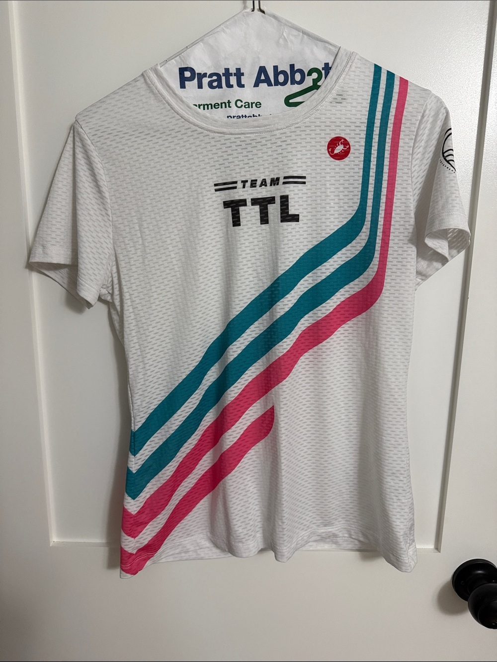 TTL Team Short Sleeve Performance Tee in White with Teal & Pink Stripes